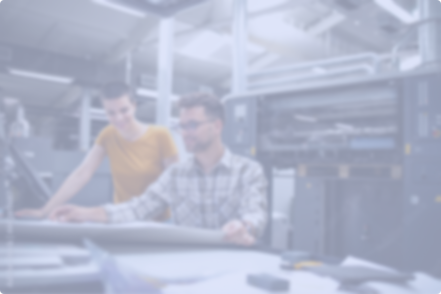 Couple sitting in front of computers